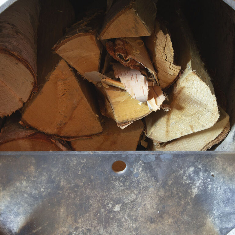 Place the logs in the fire chamber so that air can circulate between them.